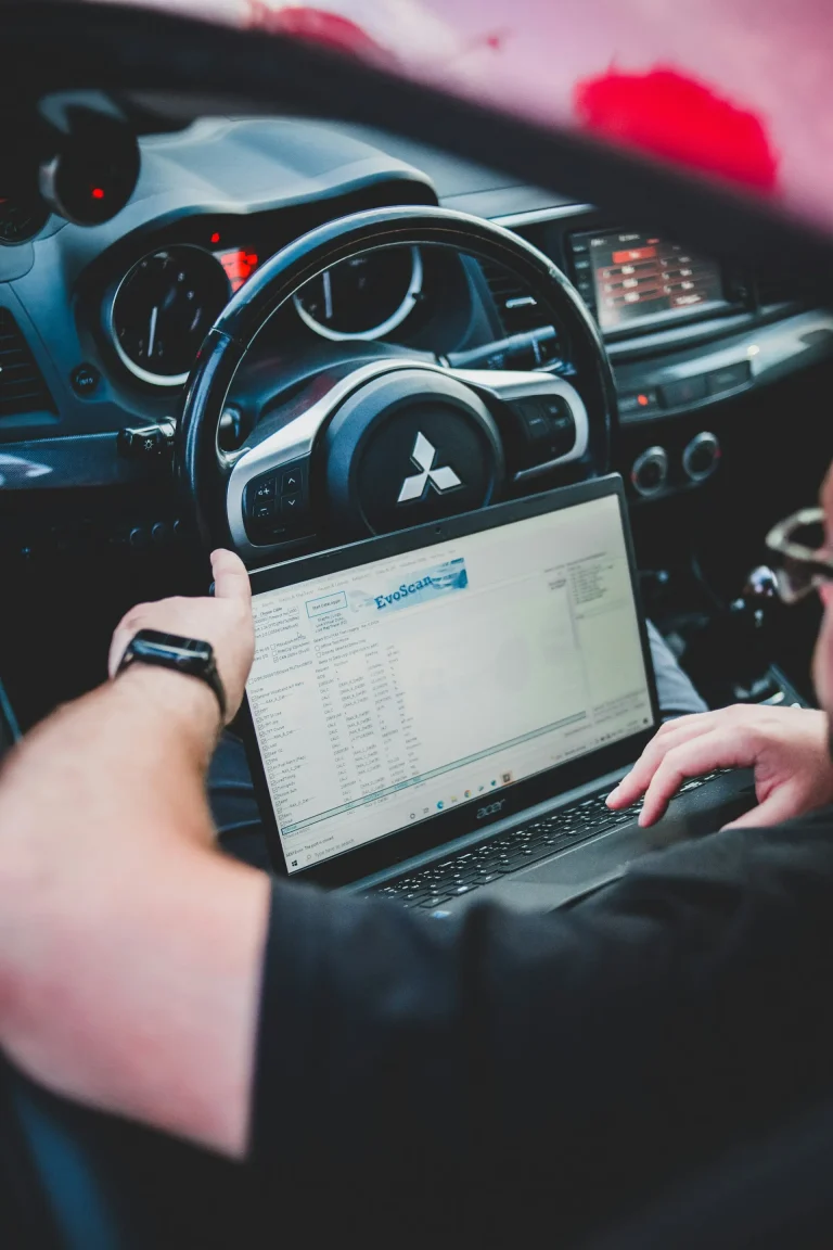 Diagnostic software on a laptop connected to a car