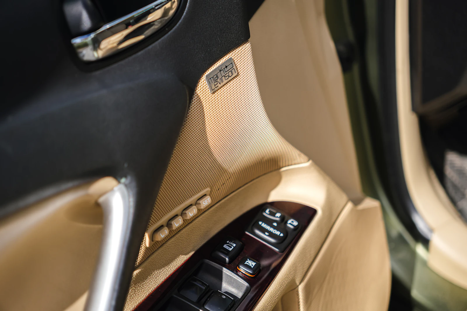 Electric window switches on a car door panel
