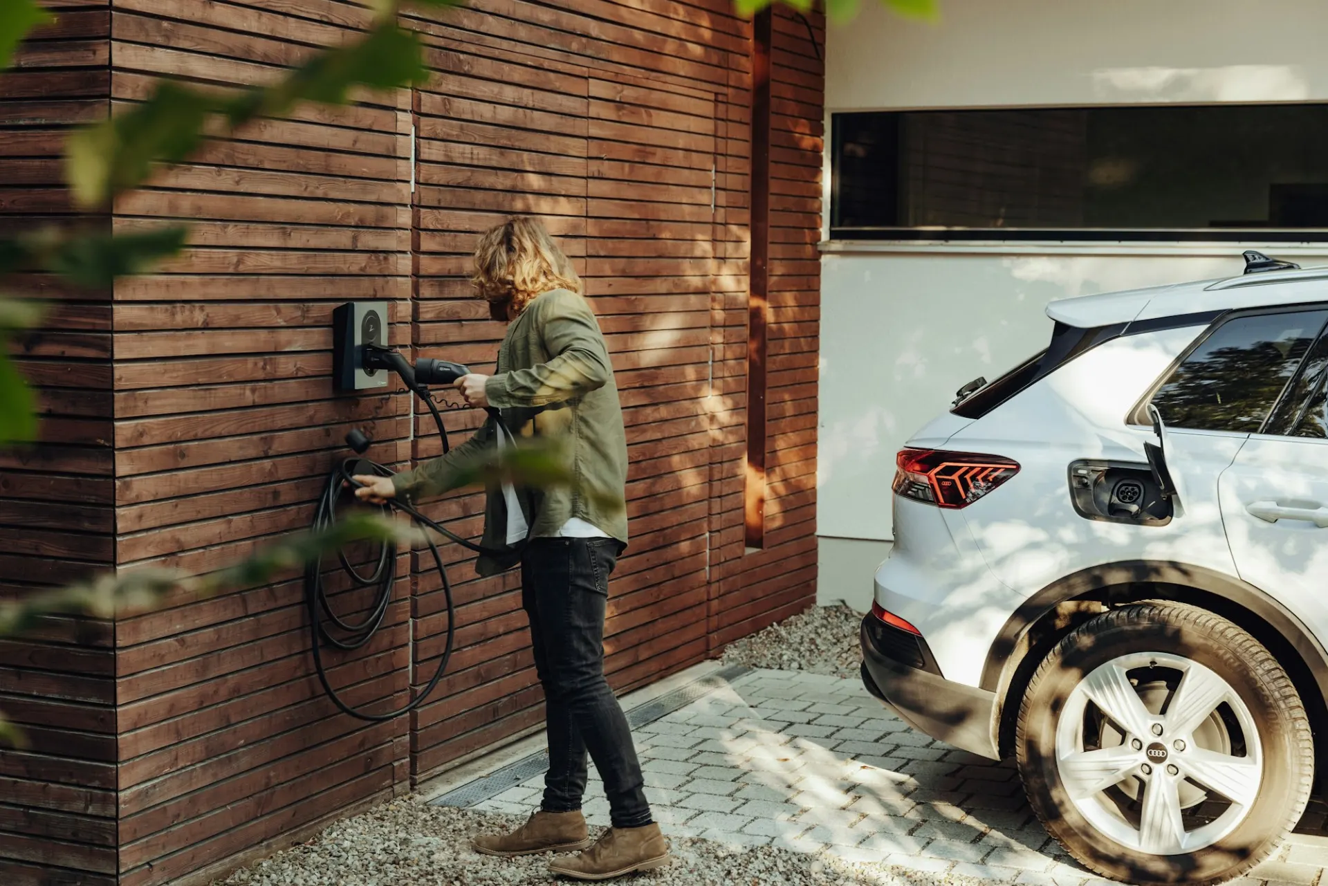 Electric car plugged into a home charger