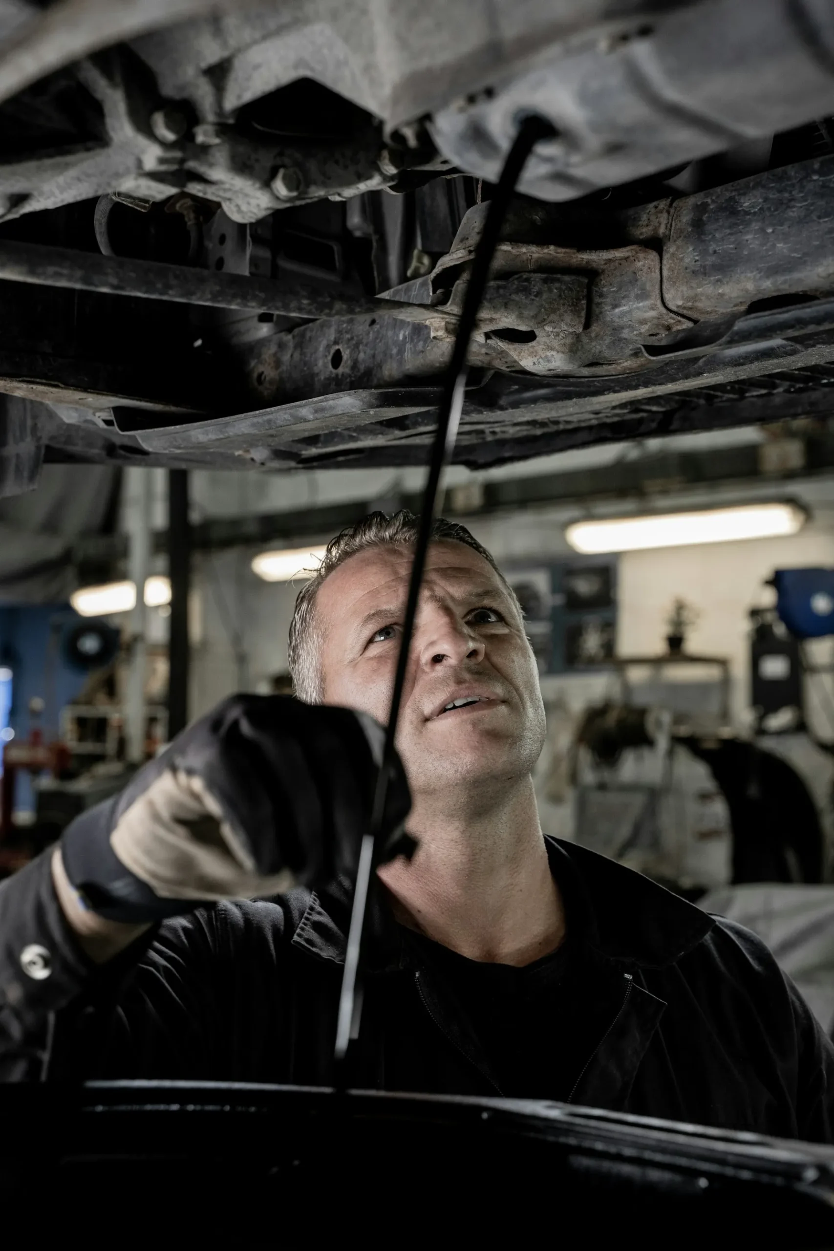 Mechanic repairing a car in the garage