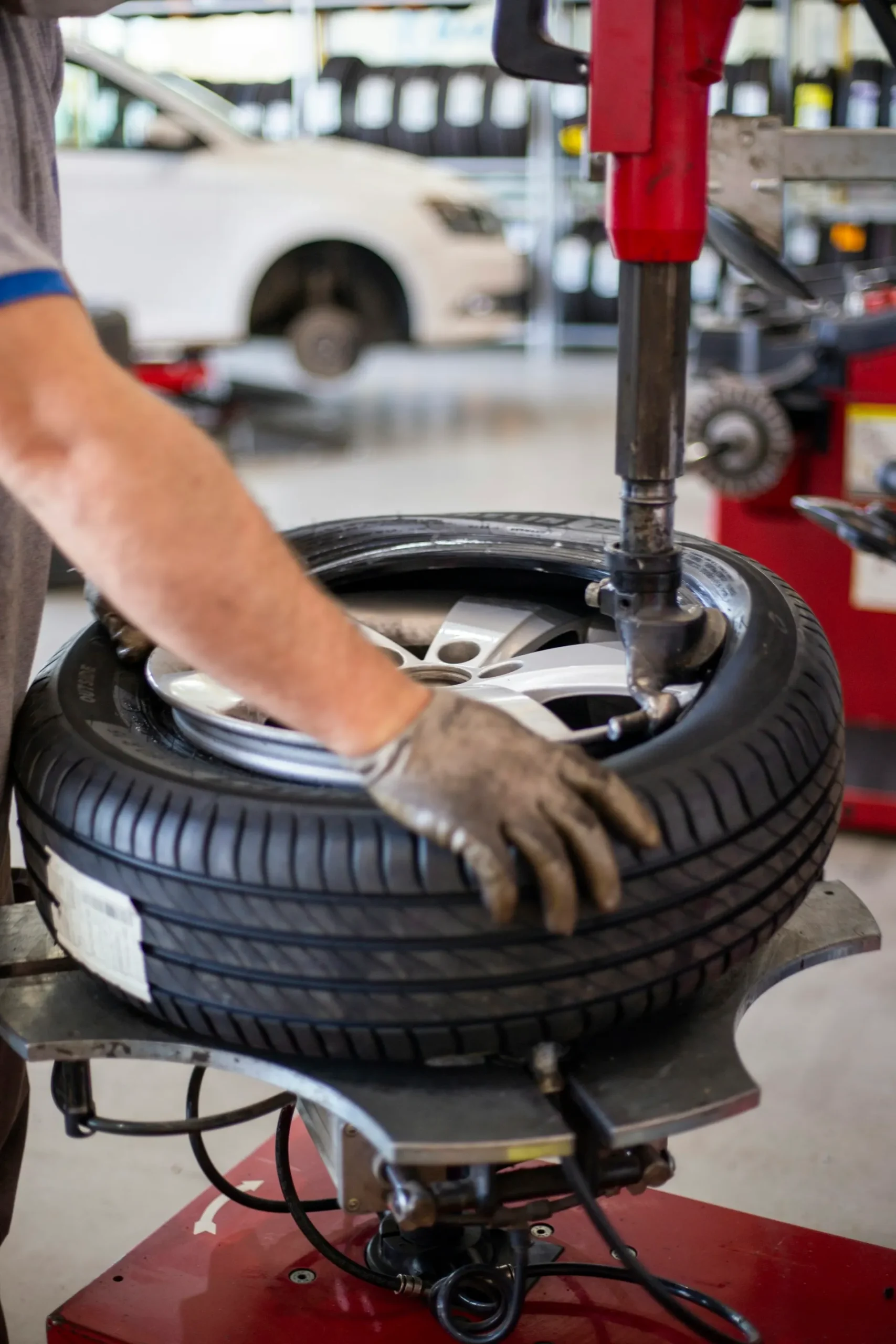 Tyre being fitted to a wheel